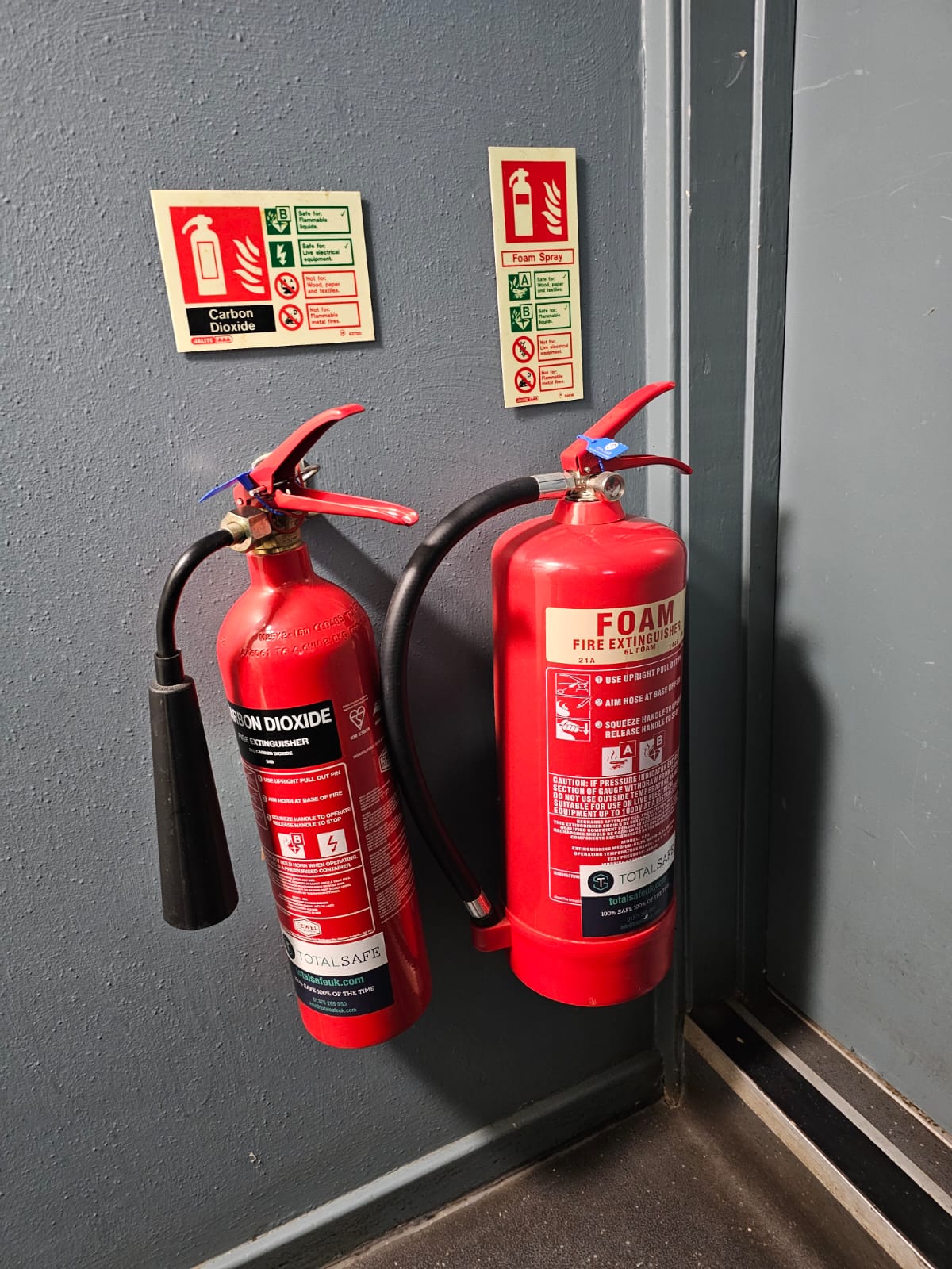 Fire extinguishers installed on wall